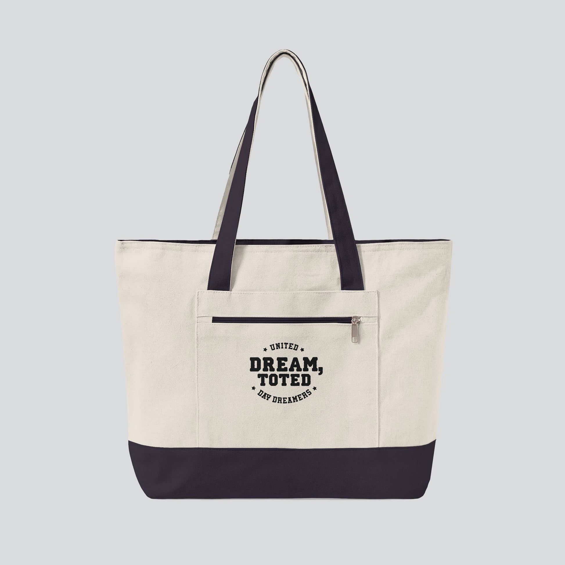 Beige tote bag with dark blue accents and text on a light gray background
